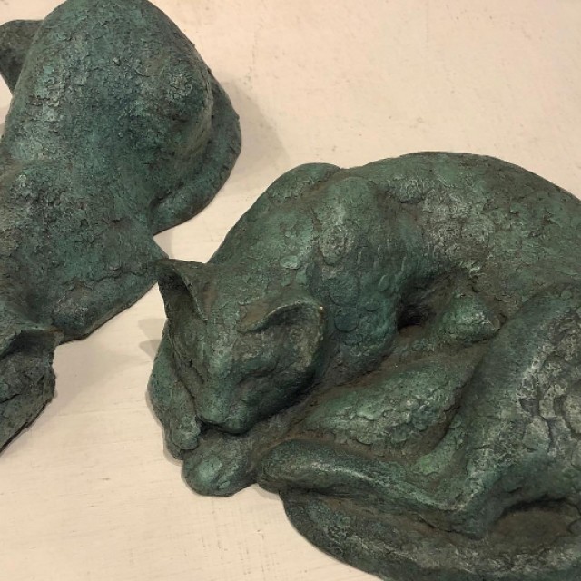 Two cat sculptures