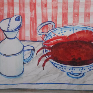 A colander with a lobster and crab sit on a table beside a watering can